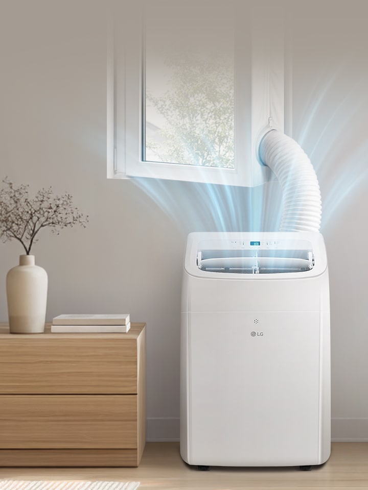 Przenośny klimatyzator LG w nowoczesnej sypialni z elastyczną rurą odprowadzającą powietrze.