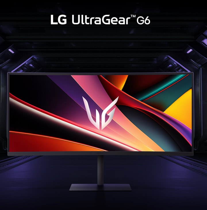 Przedni widok monitora do gier w futurystycznym, oświetlonym neonami pomieszczeniu.