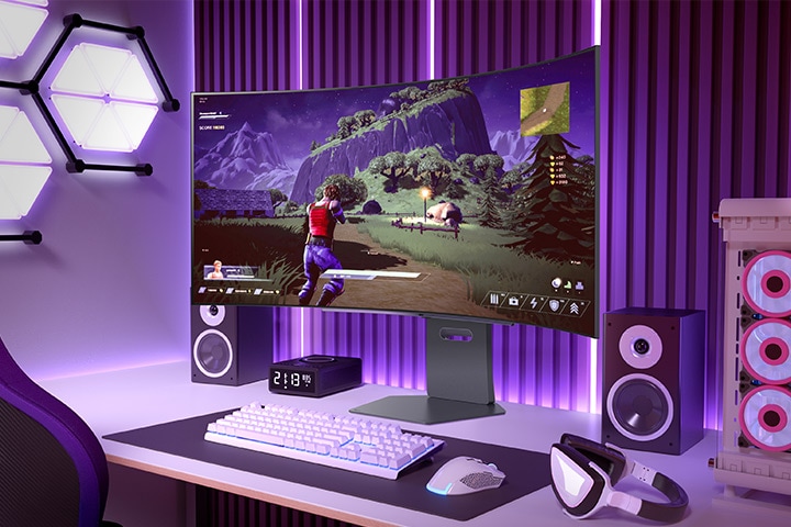 Curved gaming monitor displaying an action-adventure game in a vibrant gaming setup with purple lighting and a PC tower nearby.