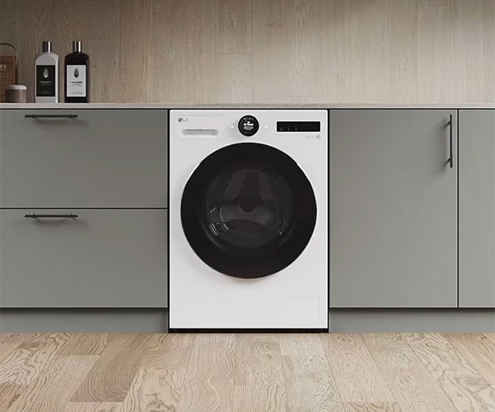 Image of LG washing machine installed in gray interior household.