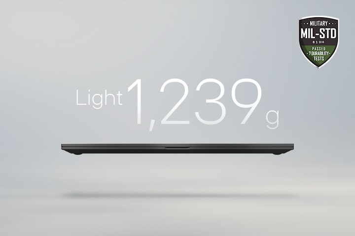 An animation showcasing a lightweight laptop with '1,239g' displayed in the first frame and '15.7mm' thickness in the second frame. Both frames include the MIL-STD durability badge, emphasizing portability and durability.