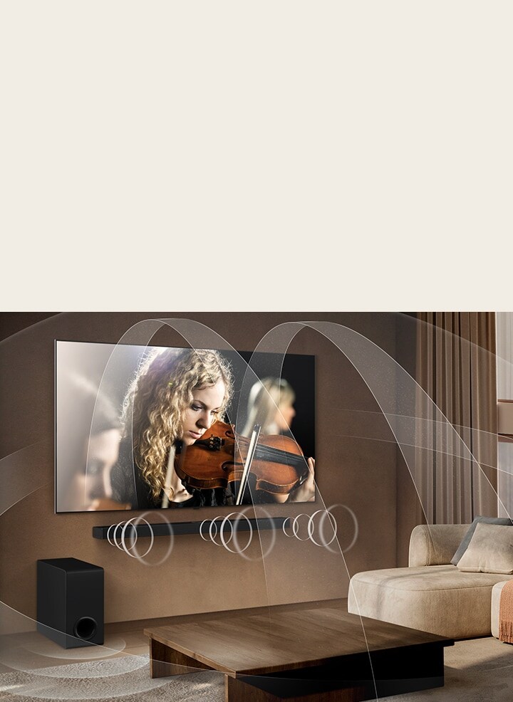 Living room with an LG OLED TV and LG Soundbar with graphics representing how both devices fill the space with multi-surround sound.	