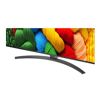 LG TV com um ecrã surpreendentemente grande montada numa parede por cima de uma LG Soundbar numa sala moderna.