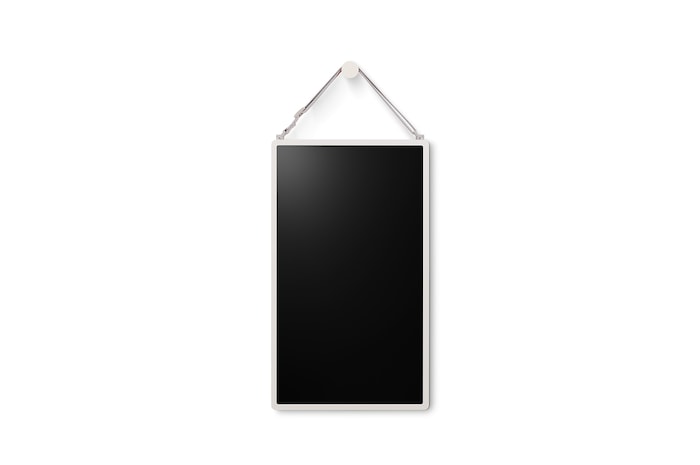 LG StanbyME 2 is hung on the wall using the wall strap.