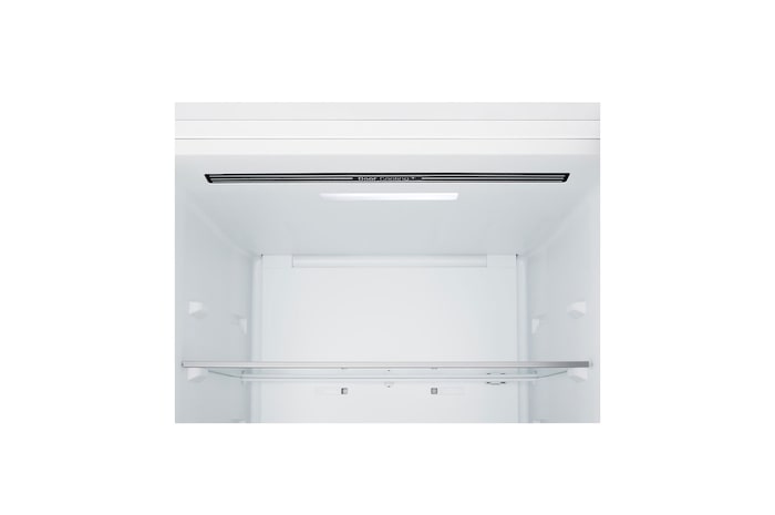 Frigorífico combinado LG (gbbsj10esw) instalado ao nível da parede alta em bege claro, com setas brancas a apontar para as superfícies superior e frontal.