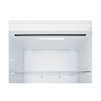 Frigorífico combinado LG (gbbsj10esw) instalado ao nível da parede alta em bege claro, com setas brancas a apontar para as superfícies superior e frontal.