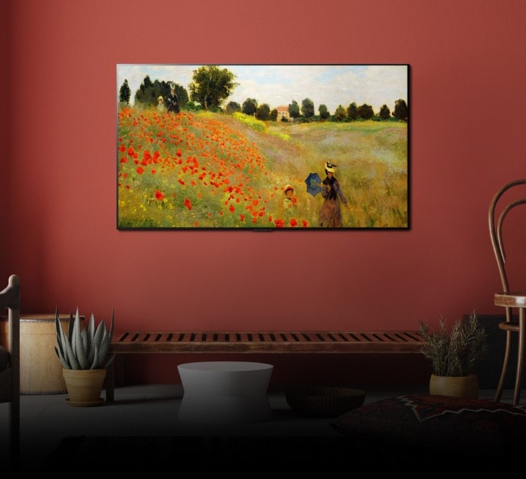 Vista em grande plano com grande angular de uma TV Gallery Design de montagem na parede a mostrar uma obra de arte Descubra como os PÍXEIS AUTOILUMINADOS tornam a vida mais artística