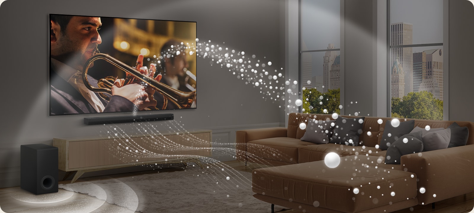 يظهر مكبر LG Soundbar وتلفزيون LG TV ومضخم صوت في شقة حديثة بالمدينة. يُصدر مكبر الصوت LG Soundbar ثلاثة فروع من الموجات الصوتية المصنوعة من قطرات بيضاء تطفو على طول الجزء السفلي من الأرض. تنطلق المزيد من الموجات الصوتية البيضاء من أعلى مكبر الصوت soundbar. يوجد بجوار مكبر الصورت Soundbar مضخم صوت يقوم بإنشاء تأثير صوتي من الأسفل. تُنشيء بشكل عام تأثير القبة في جميع أنحاء الغرفة.