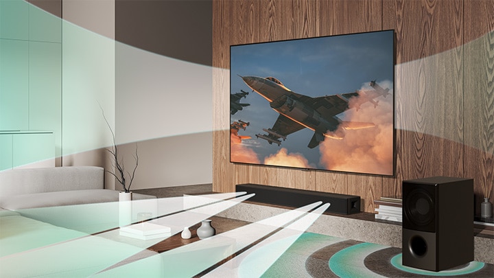 يتم عرض طائرة على تلفزيون LG TV المثبت على الحائط ويخرج التأثير الصوتي الافتراضي من تلفزيون LG TV ومكبر الصوت LG Soundbar SH5A ومضخم الصوت الخاص به بشكل متزامن مما يخلق WOW Orchestra.