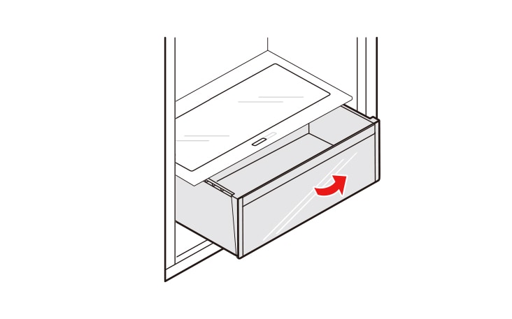 Lift the vegetable drawer up and remove it by pulling it out