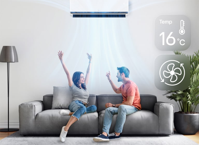 A man and a woman enjoying the cool breeze under an air conditioner set to 16 degrees