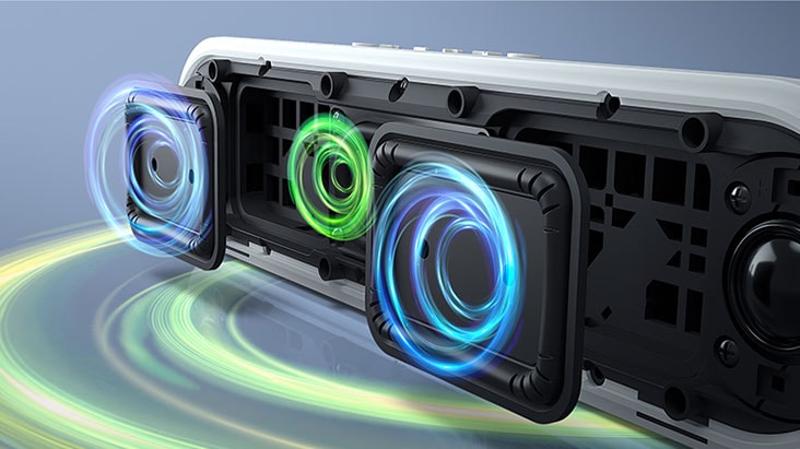 The LG StanbyME XT7S speaker is placed on the surface, showing the dual passive radiators. Blue graphics come out of the passive radiators and the bottom of the speaker.