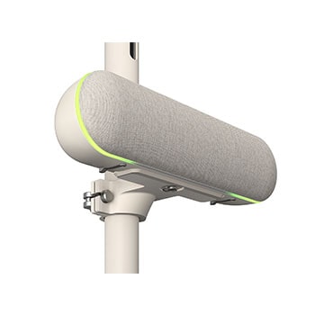 Close-up of the speaker with the left side facing forward attached to LG StanbyME. The green mood lighting is on.