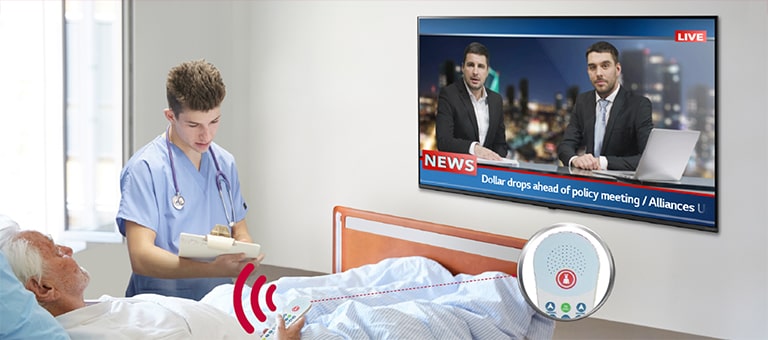 A patient lying in the bed is controlling the TV through a pillow speaker connected to the UT662M.