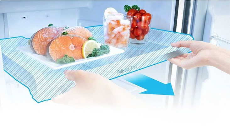 Image of a person taking out a pull-out tray of a refrigerator