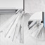 The top of the refrigerator is shown with the door swinging open and stopped at four different angles and a magnified inset of the hinge which never touches the wall it's next to.