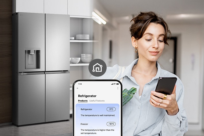Woman checking refrigerator temperature remotely on her smartphone.