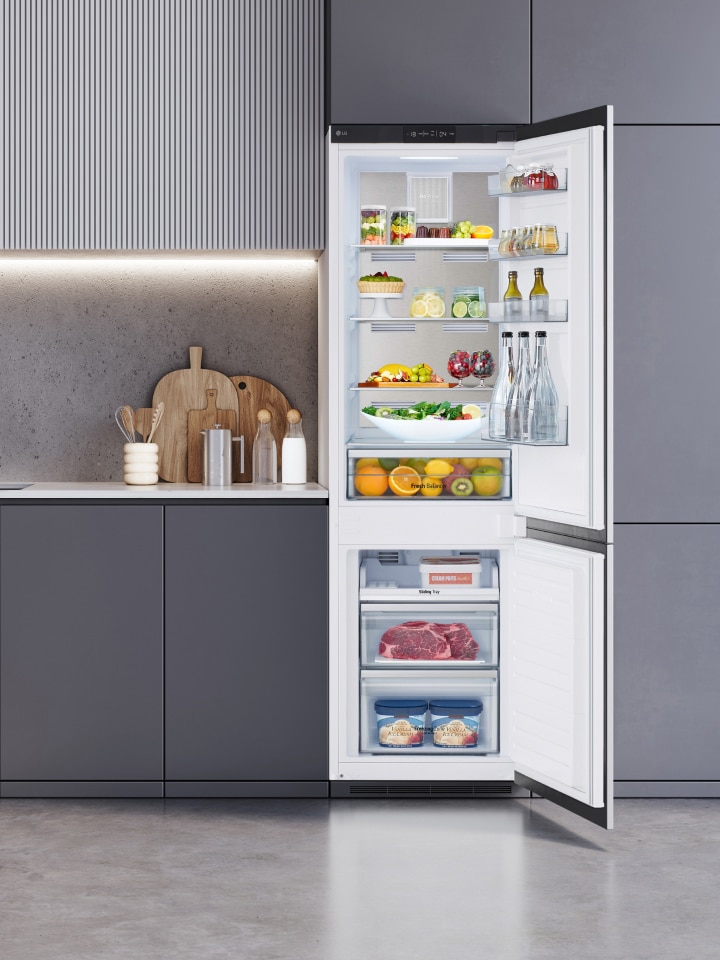 A view of LG bottom freezer refrigerator in the kitchen.