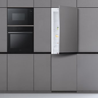 LG built-in bottom freezer refrigerator in modern kitchen.