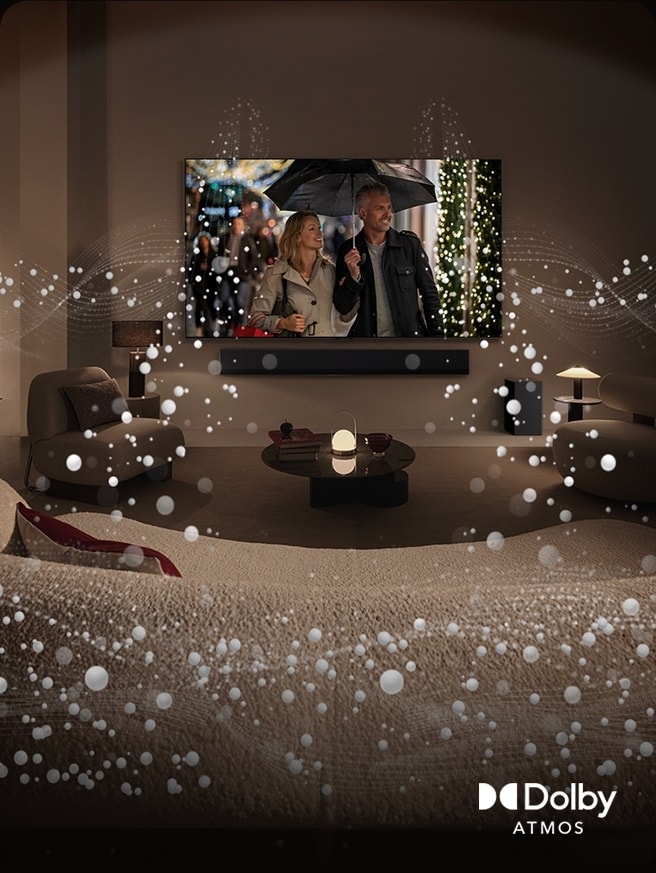 A cozy, dimly lit living space, LG OLED TV displaying a couple is using an umbrella, and bright circle graphics surround the room. Dolby Atoms logo in the bottom left corner.	