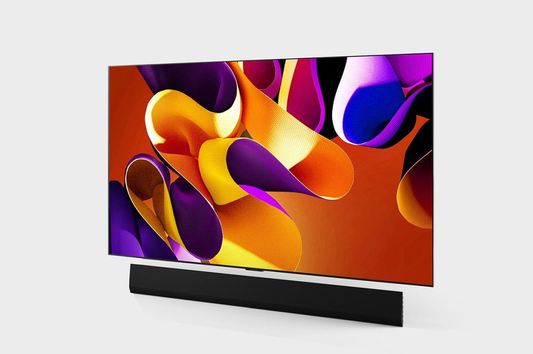 Slightly-angled left-facing side view of LG OLED evo TV, OLED G4 on the wall with the Soundbar below