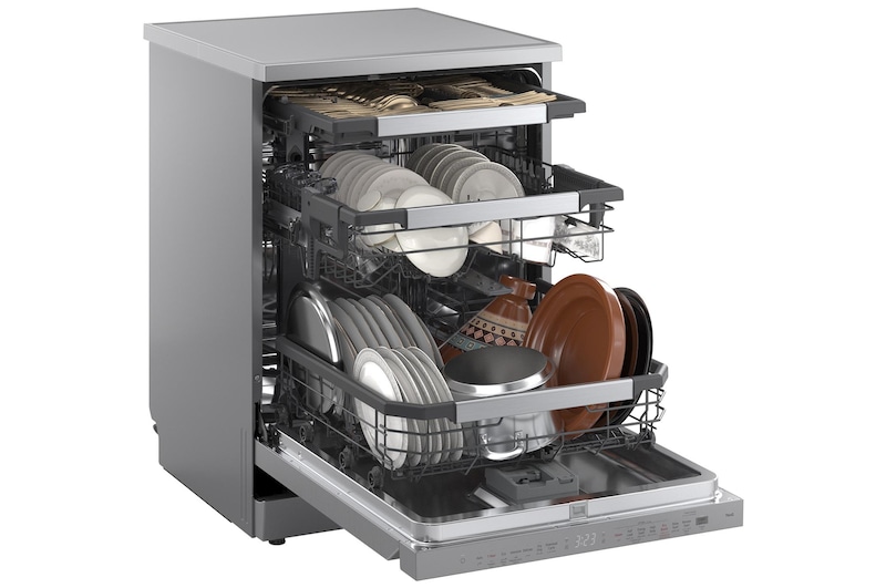 Angled view of LG dishwasher with three open racks fully loaded with dishes