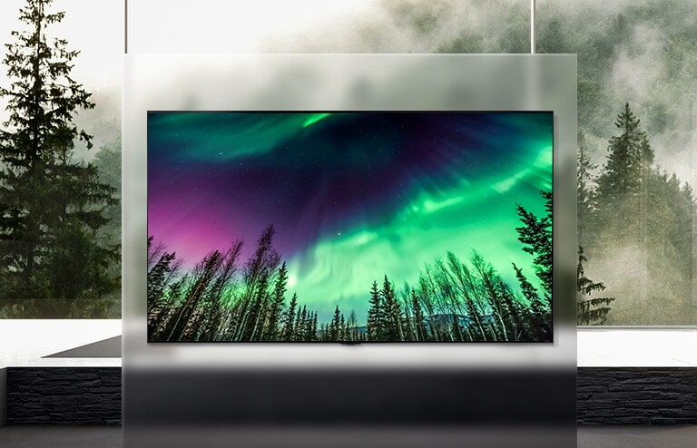 QNED TV is placed in a wide living room and the screen shows a green aurora.