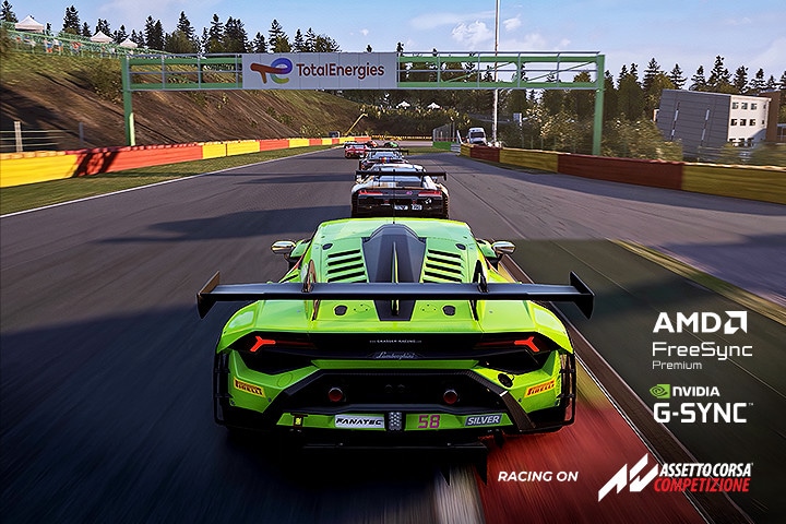 Image of a green car racing on a track.