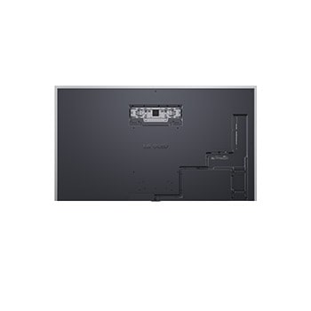 LG OLED evo AI G6 med infälld väggmontering i ett modernt vardagsrum visar ett intensivt norrsken över en lugn by på kusten och liknar en inramad bild på väggen.