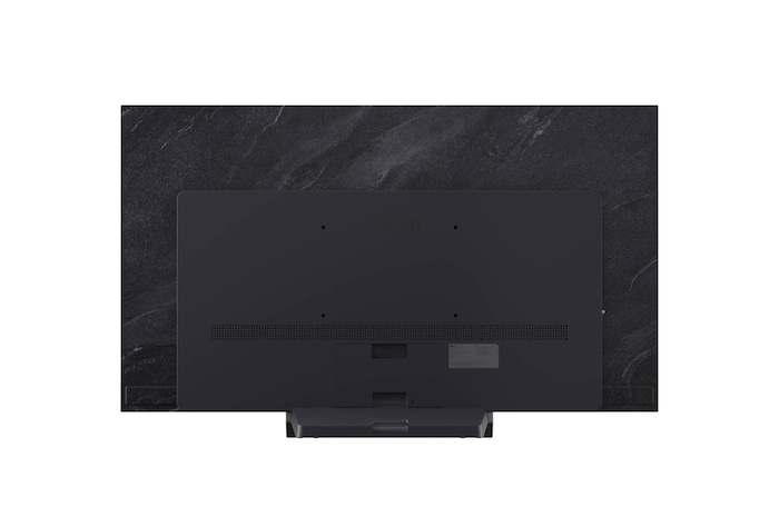 LG OLED evo AI C6 är väggmonterad i ett elegant vardagsrum, med en superslimmad design med smala ramar och visar ett stadslandskap vid en flod vid solnedgången på skärmen.
