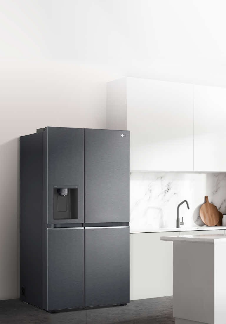 A side view of a kitchen with a black InstaView refrigerator installed.