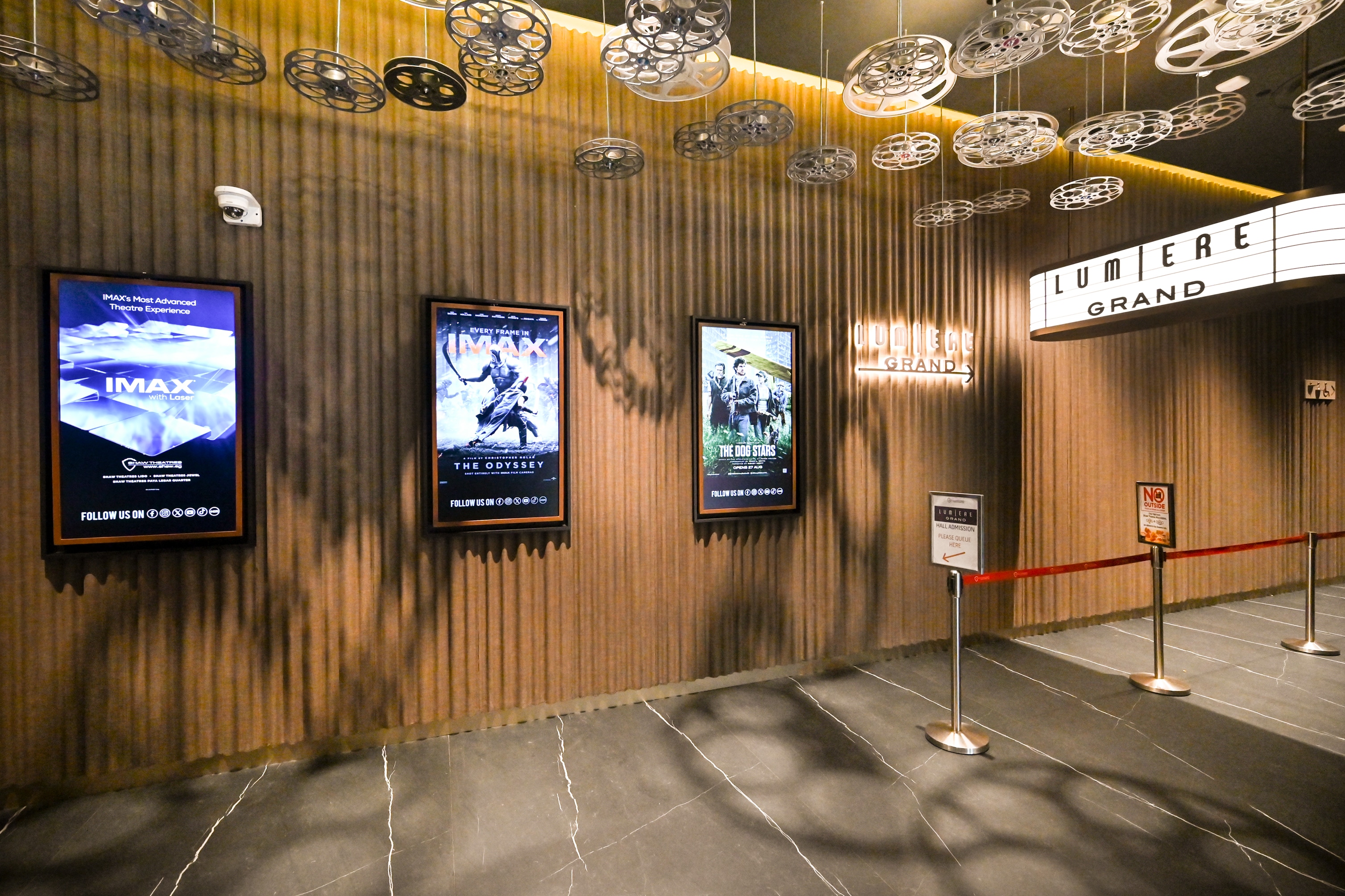 Cinema lobby with LG commercial display screens promoting films at Shaw @ Lido Theatres