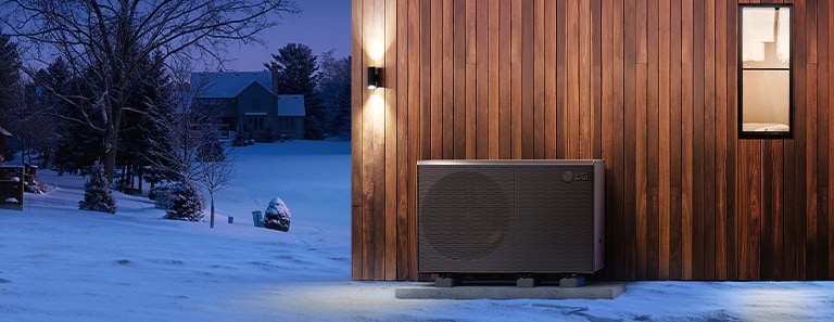 A rendering image describes an outdoor heat pump against the backdrop of snow covered village.