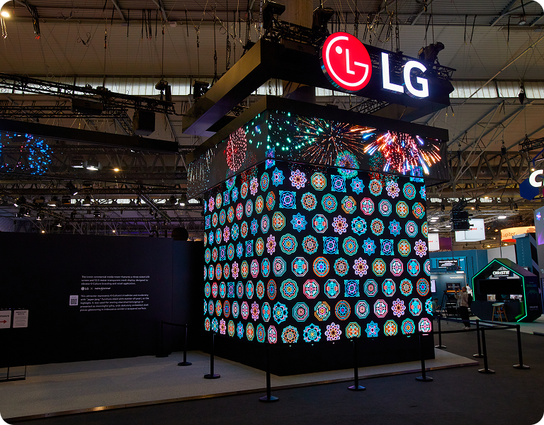 A close-up of the three-sided LED tower showcases the massive scale and vibrant digital patterns of LG’s showstopping entrance.