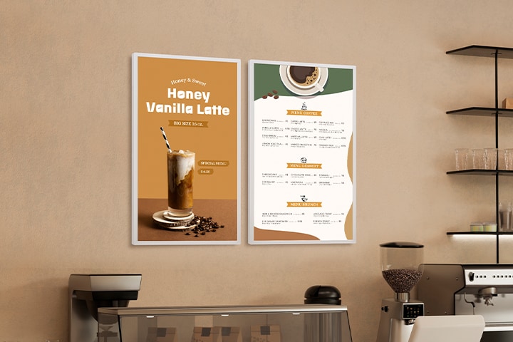 Two LG E-paper Displays are mounted on a café wall, with one displaying a beverage advertisement and the other a menu.