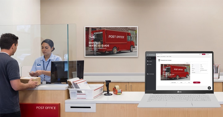 An LG E-paper Display is installed on a wall inside a post office, with both the device and on-screen content managed via webOS.