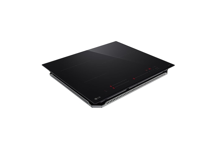 Touching the control panel of the induction hob.