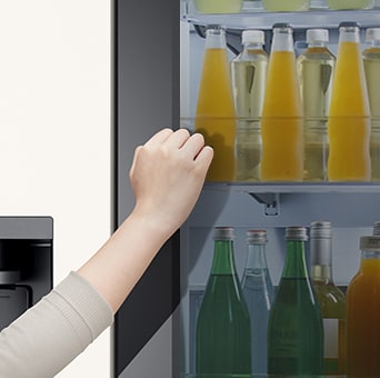 Close up view of an lg multi door refrigerator with instaview feature.