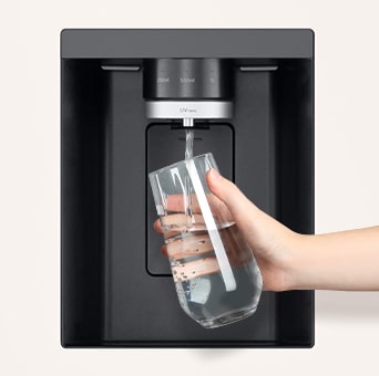 A person is getting a cup of water from lg multi door refrigerator's water dispenser.