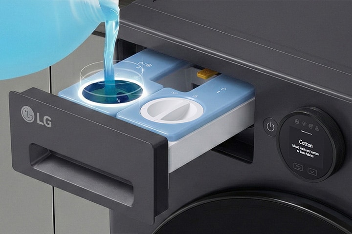 The laundry bin is open, and the detergent is poured.