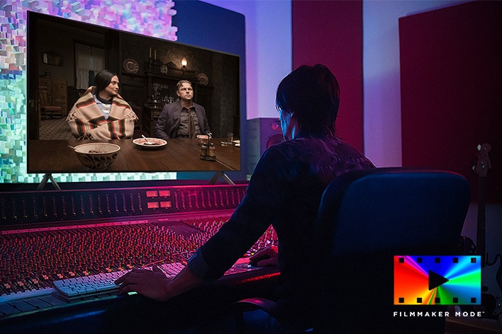 A director in front of a control panel editing the movie "Killers of the Flower Moon" on an LG NanoCell TV. In the bottom right, FILMMAKER MODE logo.