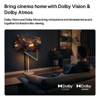 LG StanbyME 2 Max LX6 Movable Screen with Dolby Vision & Dolby Atmos shows a man watching a cinematic dragon battle in a dark room, where lifelike visuals and immersive sound create a theater-like experience at home.