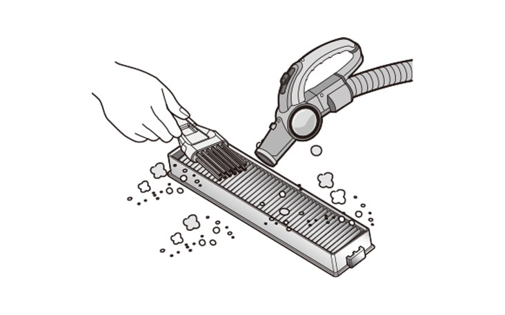 Hand cleaning an EPA filter with a vacuum cleaner.