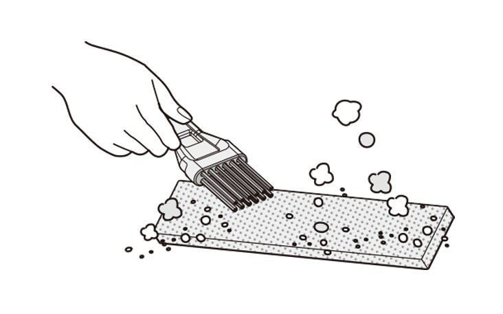 Illustration of a hand holding a brush to clean a sponge filter