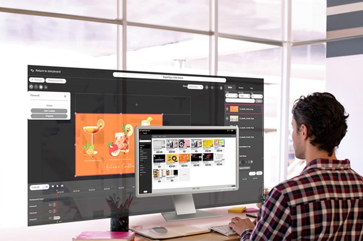 A man is creating content for the signage. The monitor screen displays a list of the generated content, while an editor for crafting content on a larger screen is also presented. Both screens provide genuine views accessible within the solution.