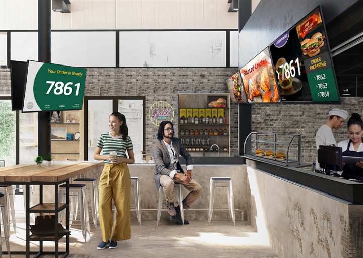 The fast-food restaurant features various types and sizes of signage screens, each displaying menus, queue numbers, food photos, and more.