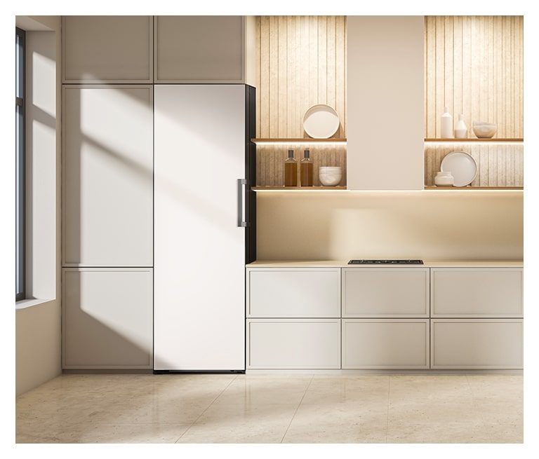 It shows mist beige color LG Freezer Objet Collection is placed in the kitchen that matches naturally to the furniture around.