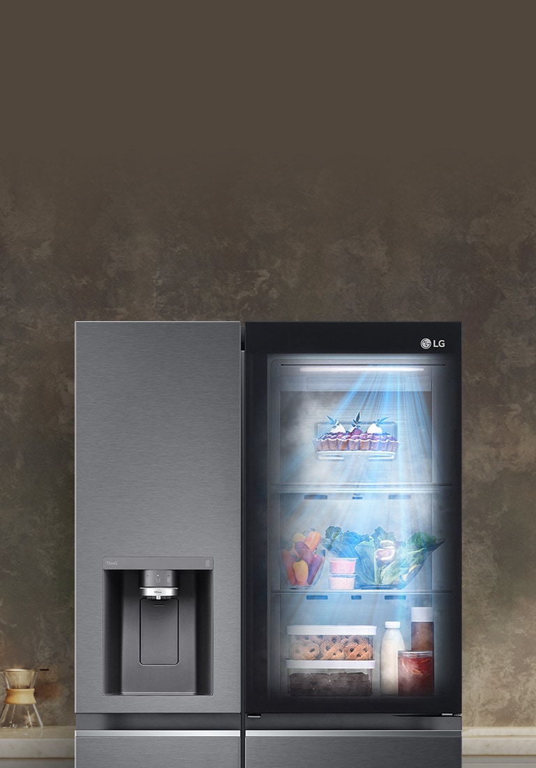 The front view of a black InstaView refrigerator with the light on inside. The contents of the refrigerator can be seen through the InstaView door. Blue rays of light shine down over the contents from the DoorCooling function.