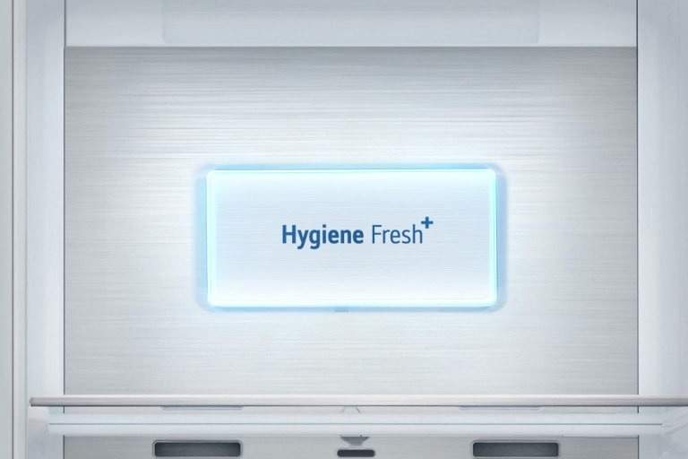 A video starts with a close up view of the "Hygiene Fresh " panel on the refrigerator. Various bacteria fly around and then everything is sucked into the "Hygiene Fresh " panel and a light shines across the panel.