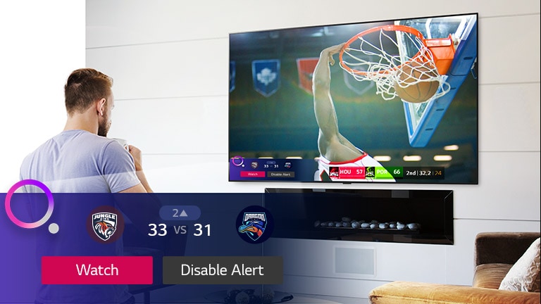 TV screen showing a scene from a basketball game with a Sports Alert